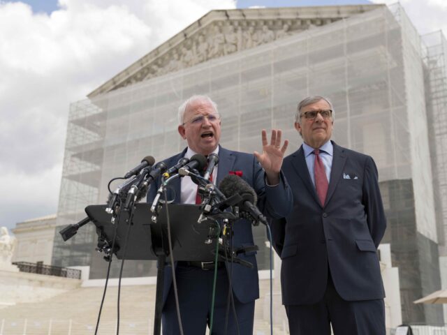 John Eastman (Jose Luis Magana / Associated Press) John Eastman, left, a California law professor accompanied by Attorney Paul Kamenar speaks