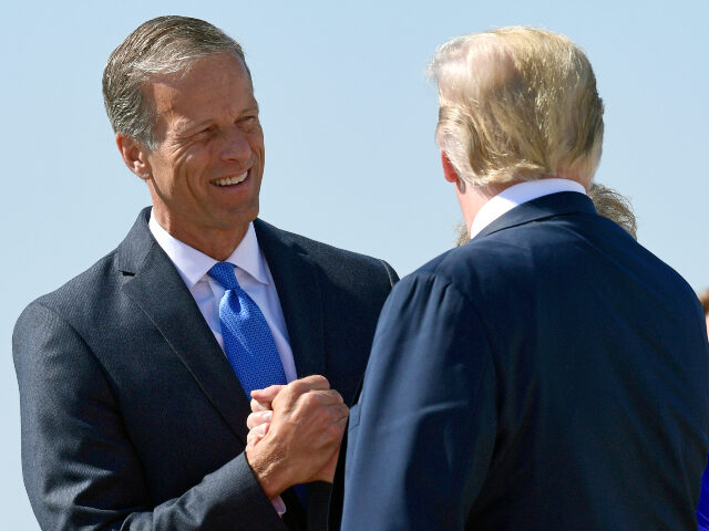 John Thune and Donald Trump President Donald Trump, right, is greeted by Sen. John Thune, R-S.D., left, after arriving