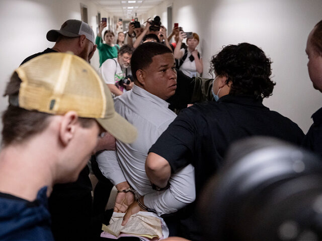 NEW YORK, NEW YORK - JUNE 6: A Dominican man is detained by plainclothes officers with Imm