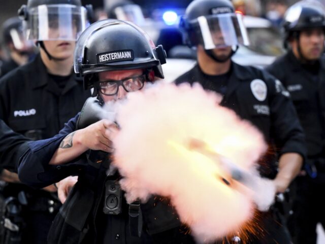 LAPD firing rubber bullet (Noah Berger / Associated Press) A law enforcement officer fires a less-lethal projectile during a protest Saturday, June 1