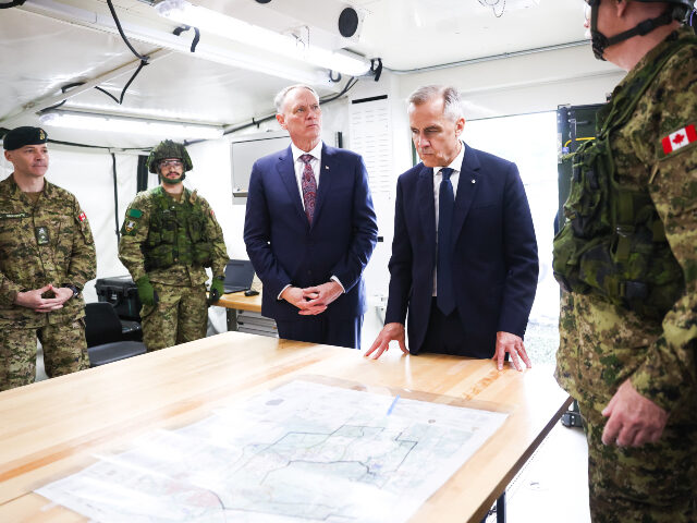 Mark Carney Canadian Prime Minister Mark Carney, right, and Minister of National Defence David McGuint