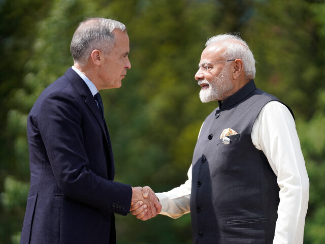 Mark Carney and Narendra Modi (L/R) Canadian Prime Minister Mark Carney greets Indian Prime Minister Narendra Modi befor