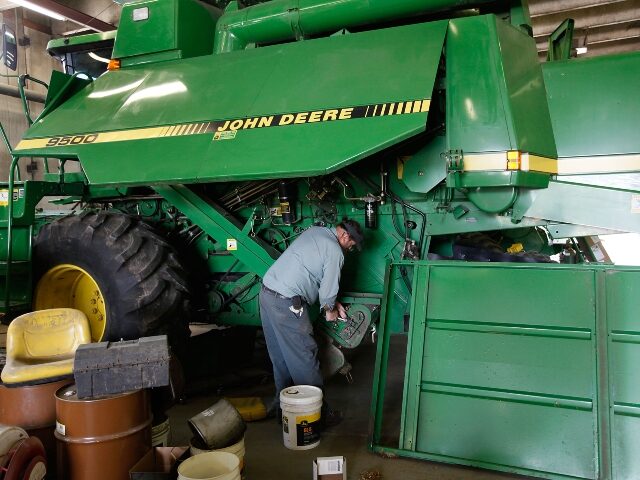 mechanic-works-on-a-john-deere-machine-640x480-1 Mechanic works on a John Deere machine