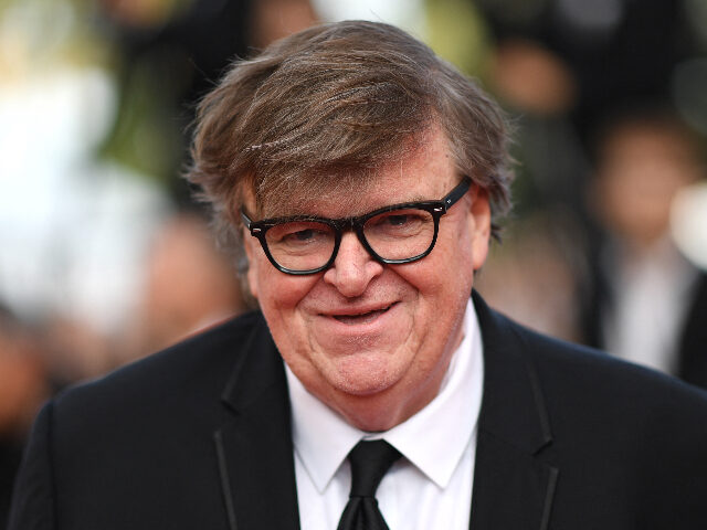 michaelmoore US director Michael Moore smiles as he arrives for the screening of the film "The Spe