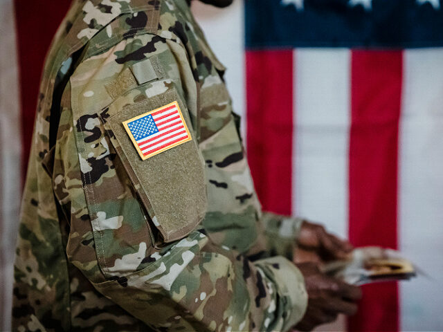 pexels-george-pak-u-s-military-american-flag A Man Wearing Military Uniform