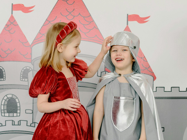 pexels-kseniachernaya-6800536 Children in Costumes Standing Beside a Castle Wall Painting