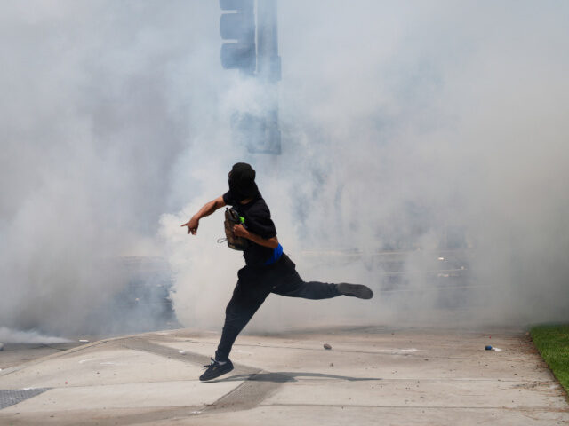 Protester Throws Rocks Downloaded 6/7/25