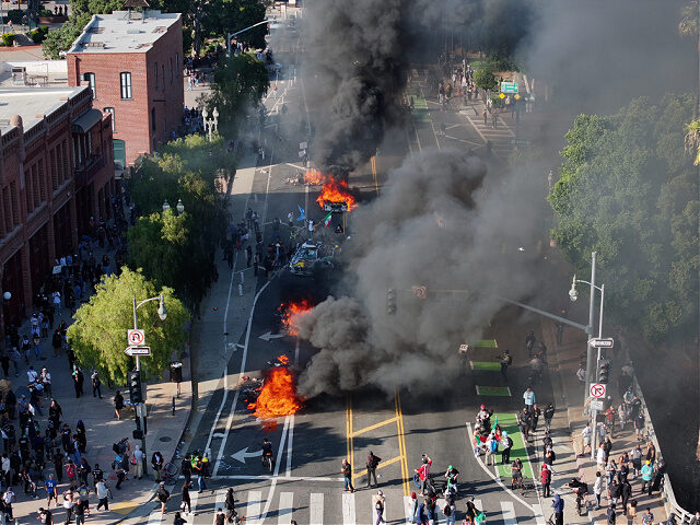 Protesters-clash-with-police-Los-Angeles-Jun8-25-getty LOS ANGELES, CALIFORNIA, US - JUNE 8: Smoke rises during clash between police and demonstr