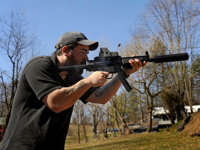 short-barrel rifle THURMONT, MD - MARCH 12: There's burst of smoke and ejecting shell as A.J. Wynne shoots a
