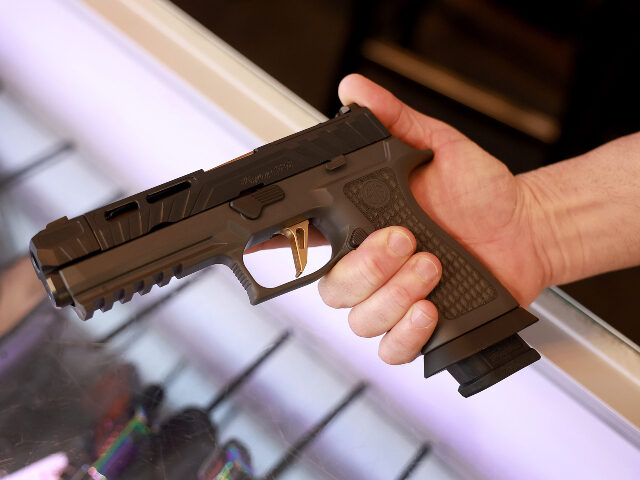 Sig Sauer P320 handgun A Sig Sauer P320 handgun is held at the WEX Gunworks store on January 31, 2023 in Delray B