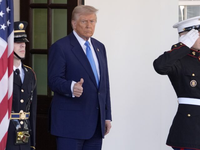 Trump Marines thumbs up (Manuel Balce Ceneta / Associated Press) President Donald Trump gives a thumbs-up as he waits to greet France's President Emma