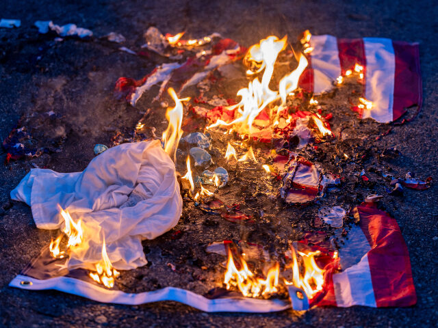 U.S. flag burning on ground during L.A. anti-ICE riots A burnt US flag is seen on the ground amid clashes with law enforcement in the streets sur