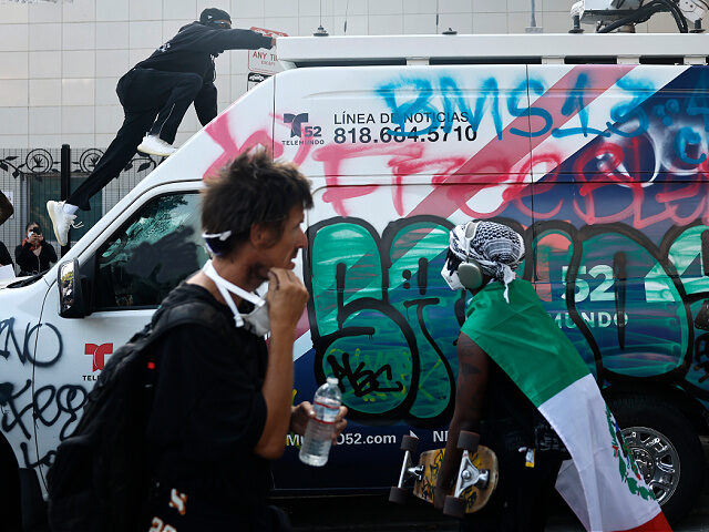 vandalized-news-van-Los-Angeles-June-9-2025-riots-getty LOS ANGELES, CALIFORNIA - JUNE 09: (EDITORS NOTE: Image contains profanity) A person climb