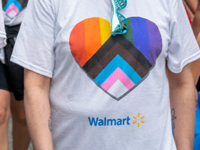 Walmart TORONTO, ONTARIO, CANADA - 2022/06/26: A group of people belonging to Walmart marches duri