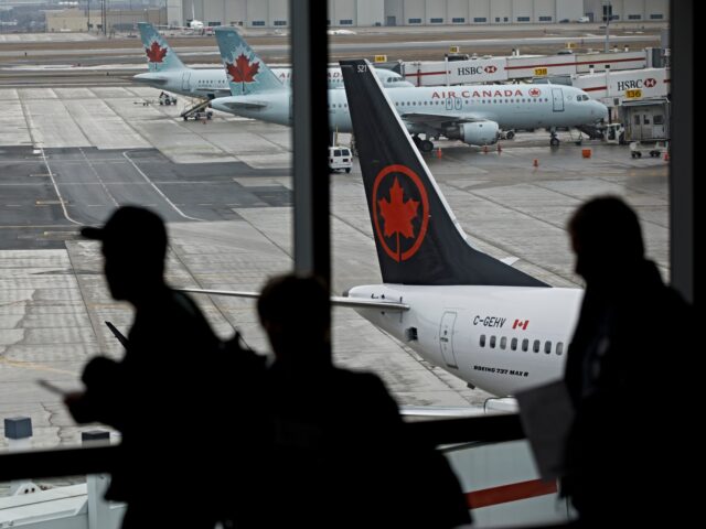 woke air canada TORONTO, ON - MARCH 13: The tail of a grounded Air Canada Boeing 747 MAX 8 is seen at Toro