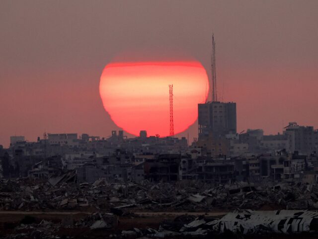 Gaza sunset (Jack Guez / AFP via Getty) TOPSHOT - This picture taken from a position on the Israeli border with the Gaza Strip, sh