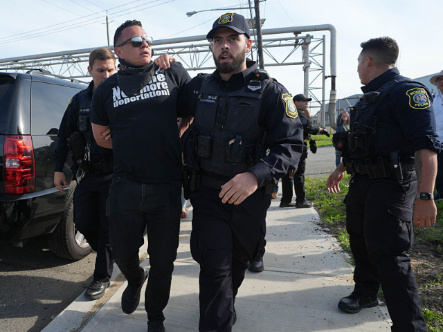 GettyImages-2214198596 NEWARK, NEW JERSEY - MAY 12: Faith ministers blocked the entrance to the ICE Delaney Hall