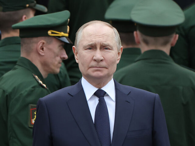 MOSCOW, RUSSIA - JUNE 22: (RUSSIA OUT) Russian President Vladimir Putin, surrounded by ar