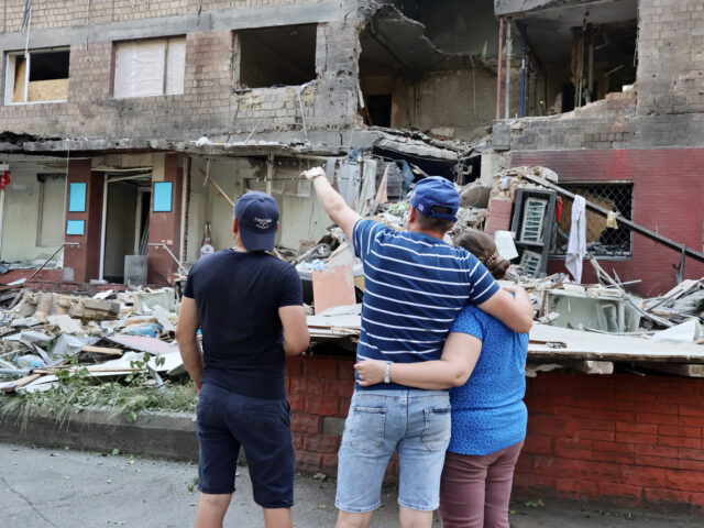 gettyimages-2223588347-1-640x480-1 KYIV, UKRAINE - JULY 4: People look at a 5-story residential building in Solomyanskyi dist