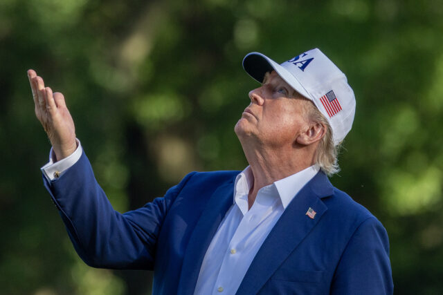 President Trump Returns To Washington On Sunday Evening WASHINGTON, DC - JULY 06: U.S. President Donald Trump looks up at the new flag on the sout