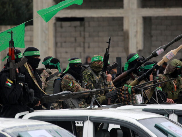 Hamas Fighters Palestinian Hamas fighters carry their guns in Nuseirat in the central Gaza Strip, as prep