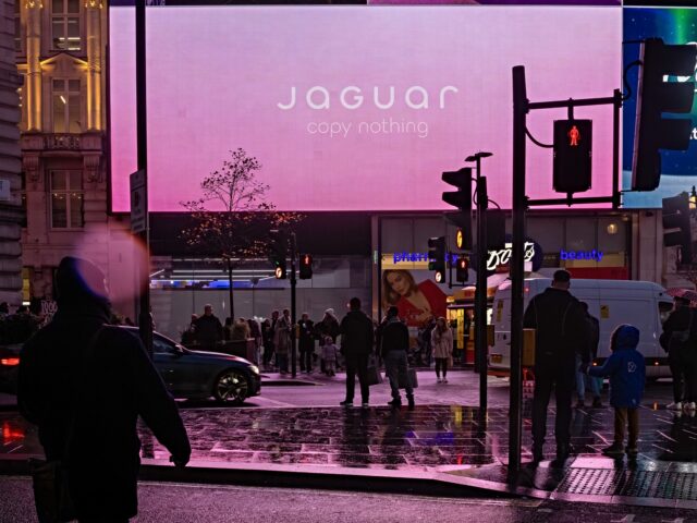 Digital screens at Piccadilly Circus display an advertisement for the Jaguar Type 00 conce