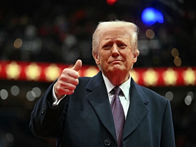 US President Donald Trump give the thumbs up during the inaugural parade inside Capitol On